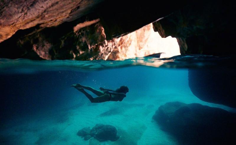 Swimming underwater cave shot by Eugene Tan