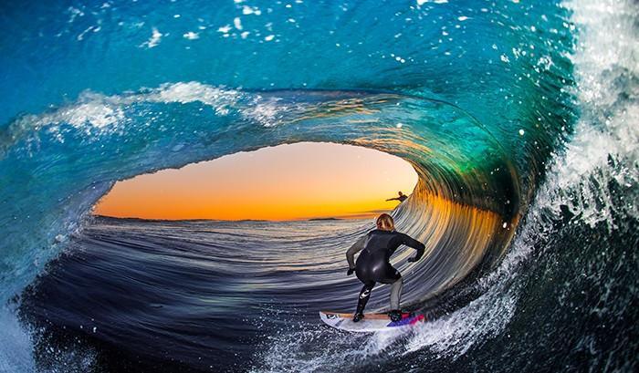 Surfer in a barrel by Leroy Bellet