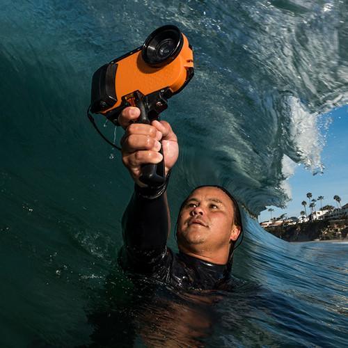 diver in wave with iPhone water housing